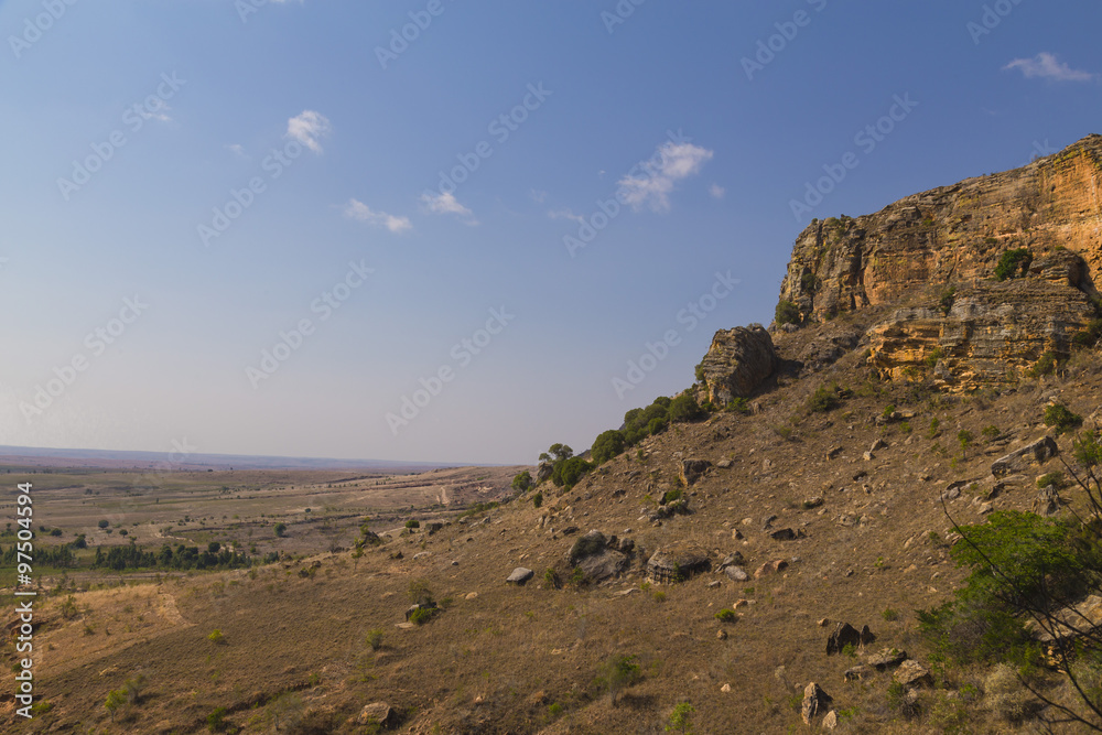 Rocky hill view on a blue sunny day in Isalo National Park landscape, Madagascar, Africa.