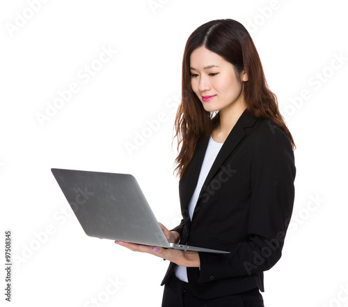 Asian Young Businesswoman working with laptop computer © leungchopan