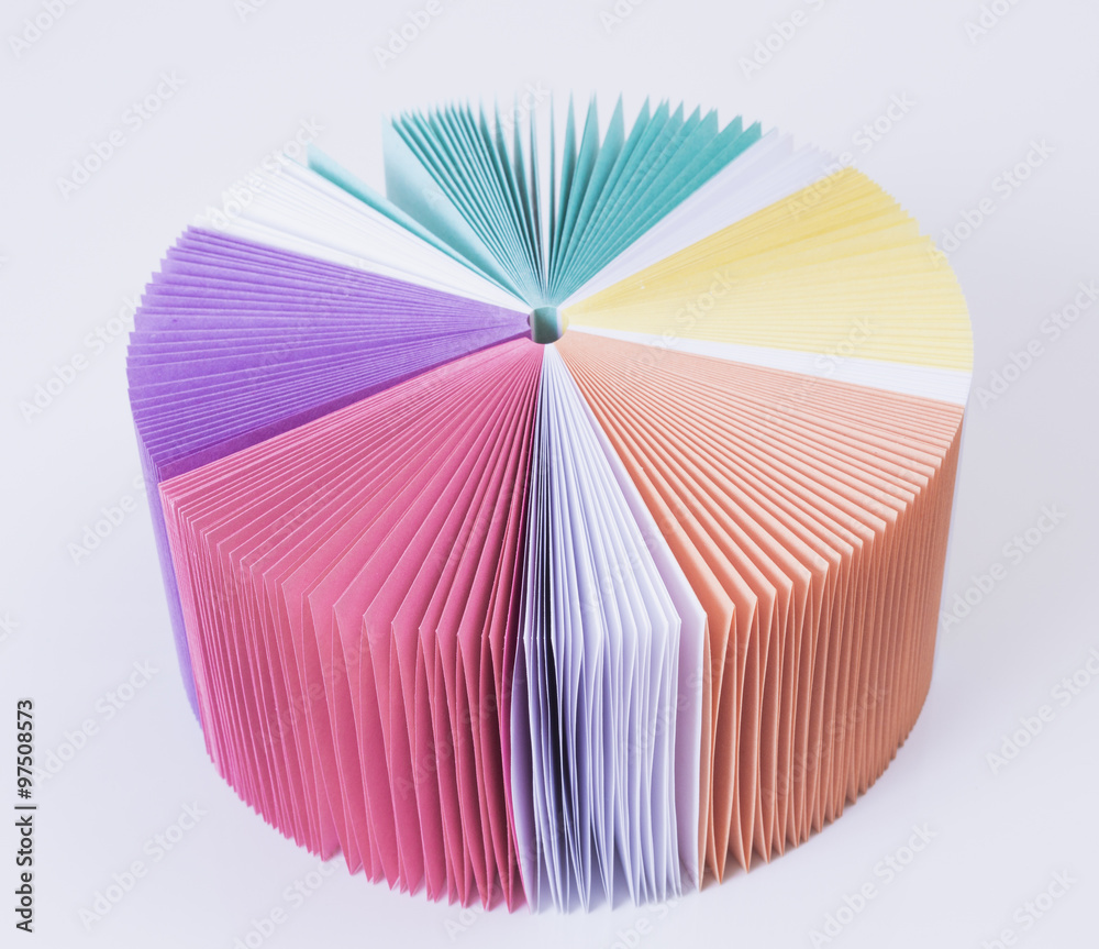 colored paper for notes rainbow on a white table. White background.