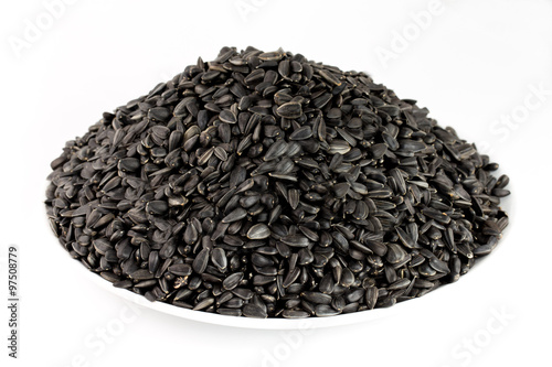 Obraz na plátně sunflower seeds pile against white background