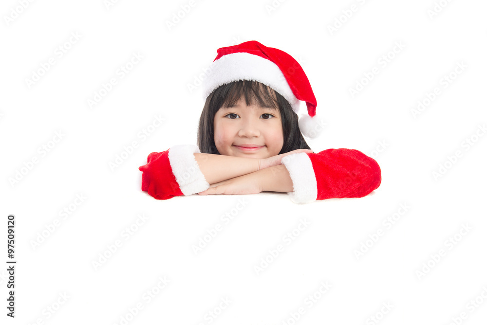 Little asian girl in in Santa Claus uniform with an empty bann Little asian girl in in Santa Claus uniform with an empty bann
