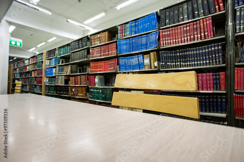 book on desk in library with book column background