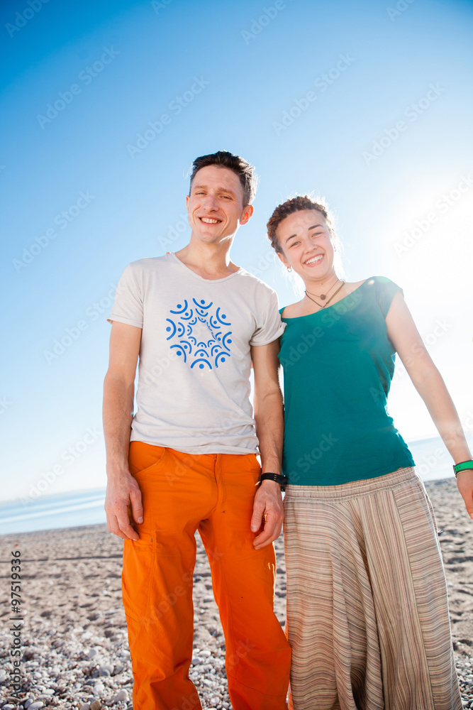 Young couple posing on the beach