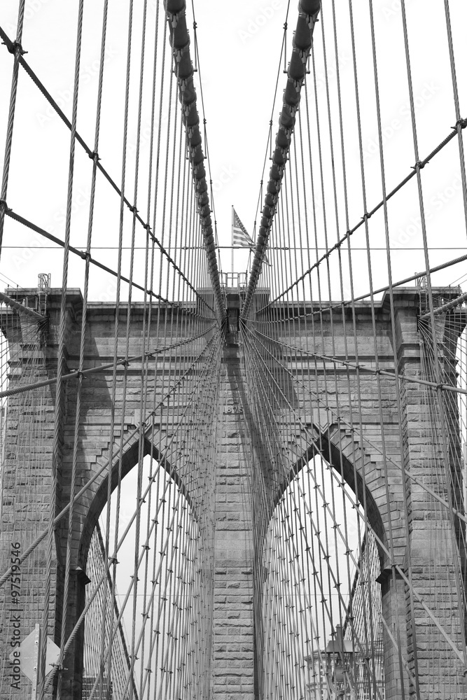Fototapeta premium Brooklyn Bridge against sky black and white