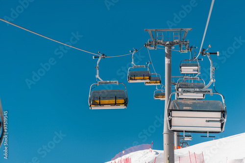 Ski lifts durings bright winter day photo