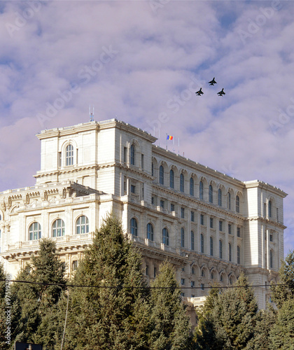 MiG-21s of the Romanian Air Force overfly the Parliament on Romania's National Day photo