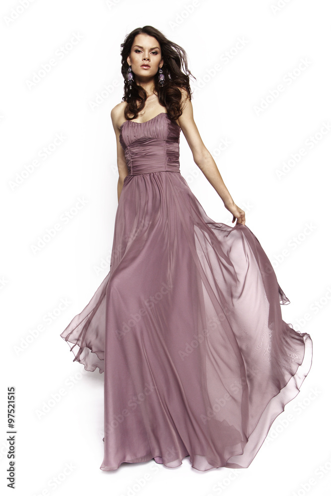 Brunette model in violet dress posing
