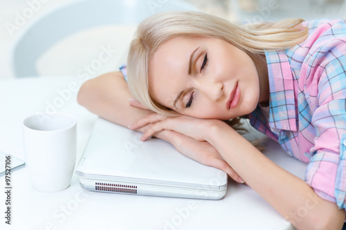 Pleasant woman  sleeping on the table  photo