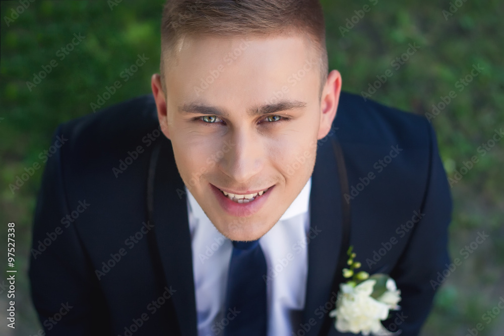Smiling bride looks into camera raising his head Smiling bride looks into camera raising his head