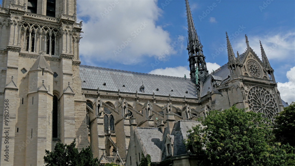 The outside look of the Notre Dame Cathedral. The cathedral is widely considered to be one of the finest examples of French Gothic architecture and it is among the largest The outside look of the Notre Dame Cathedral. The cathedral is widely considered to be one of the finest examples of French Gothic architecture and it is among the largest