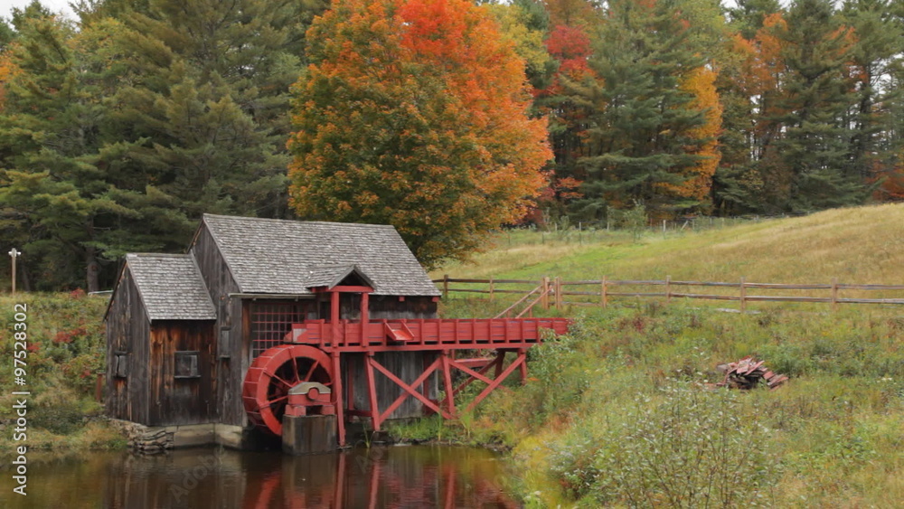 Pan of an old grist mill near Guildhall, Vermont with brilliant Fall foliage in the background. Pan of an old grist mill near Guildhall, Vermont with brilliant Fall foliage in the background.