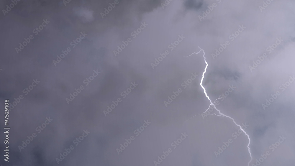 Airplane flying through heavy thunderstorm clouds, lightning bolts strike ahead. Pilot's point of view, aircraft shaking in severe turbulence. Risk of accident, the hazards of flying in the storm
