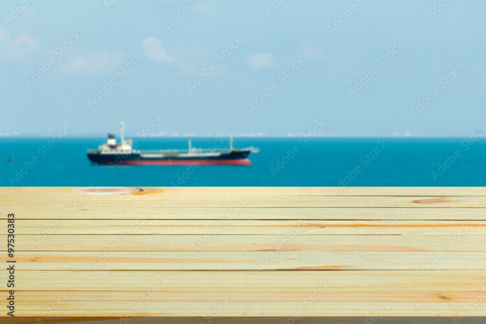 wood floor with blurred sea background. 