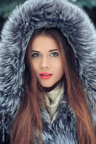 beautiful smiling girl . Winter portrait. fur hood photo