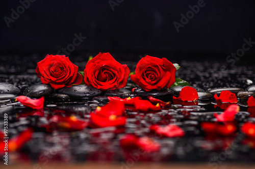 Fototapeta Naklejka Na Ścianę i Meble -  Still life with three red rose.petals and therapy stones