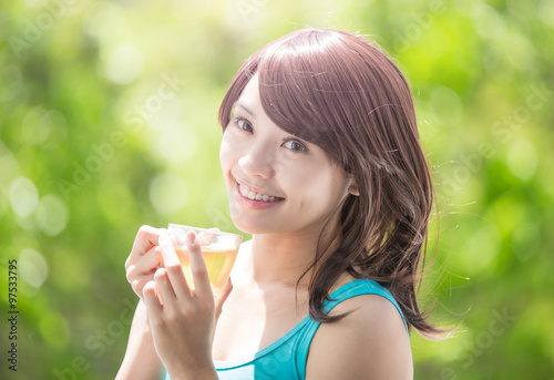 Young Woman drinking green tea