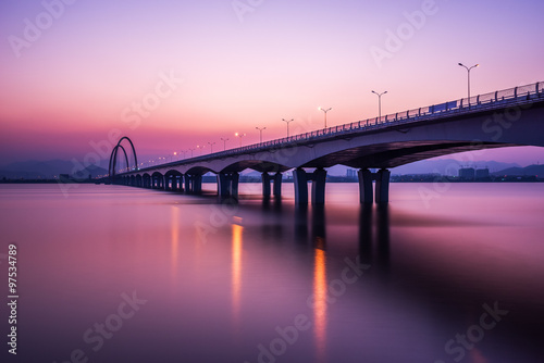 Fototapeta Naklejka Na Ścianę i Meble -  sunrise,sunset skyline and bridge over river