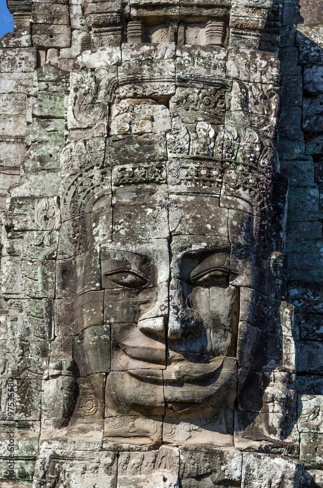 Ancient stone face of Bayon temple in Angkor Thom Ancient stone face of Bayon temple in Angkor Thom