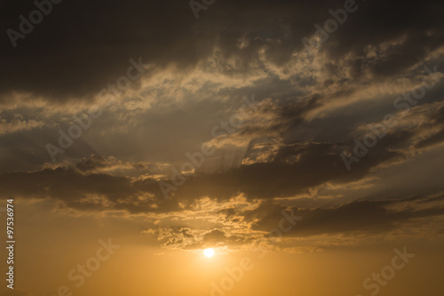 sunset sky background, light rays of sunbeam in evening © sutichak