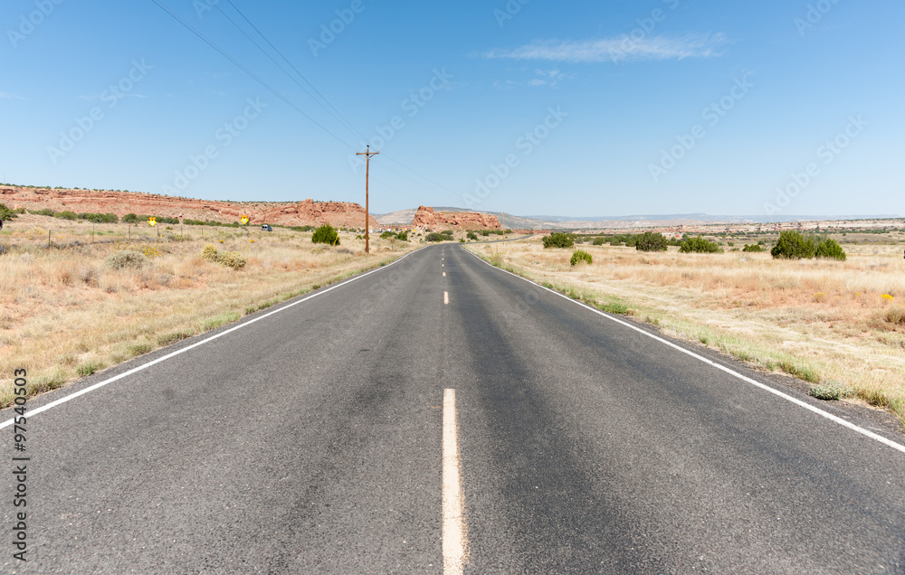 Long straight road ahead through desert of New Mexico, USA. Long straight road ahead through desert of New Mexico, USA.