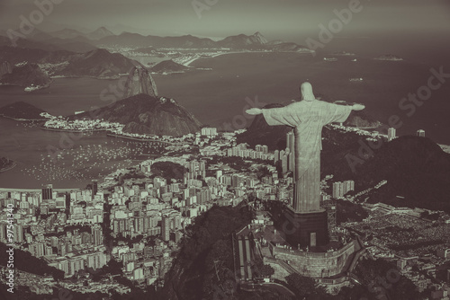 Aerial view of Christ and Botafogo Bay from high angle. Monochrome colors
