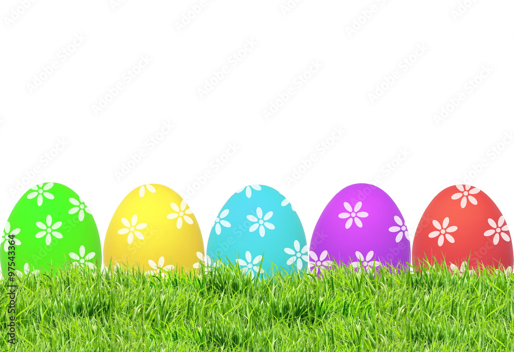 Easter eggs on green grass isolated on white
