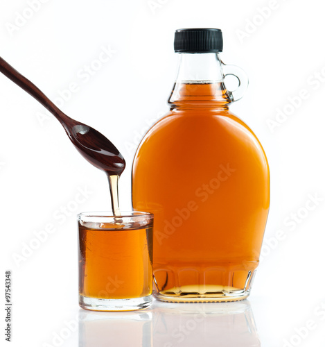 Obraz na plátně maple syrup in glass bottle on white background