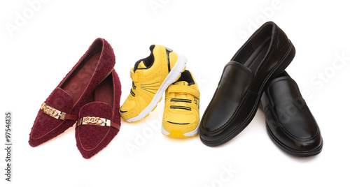 three pairs of shoes for dad mom and son on a white background as family concept