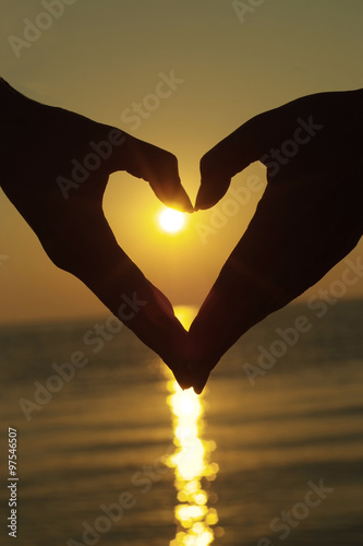 Hands silhouette against the sunset