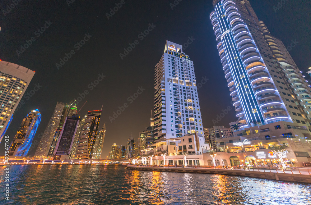 Fototapeta premium Street view of Dubai Marina skyscrapers at night