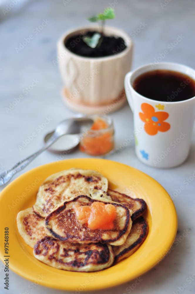 Tea and pancakes with jam for breakfast Tea and pancakes with jam for breakfast