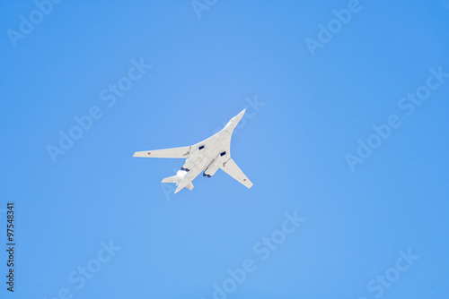 Tupolev Tu-160M (Blackjack) supersonic, variable-sweep wing heavy strategic bomber flies against blue sky background