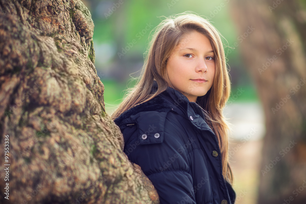 Outdoor photo from a young teenager girl in the park Outdoor photo from a young teenager girl in the park