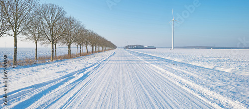 Road through a snowy landscape in winter