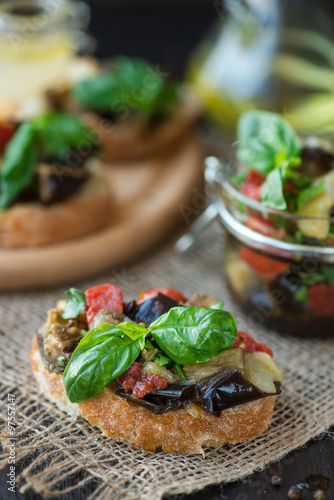 Toast with baked eggplant with tomatoes, garlic