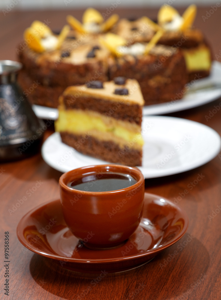 cake with a cup of coffee on the table cake with a cup of coffee on the table