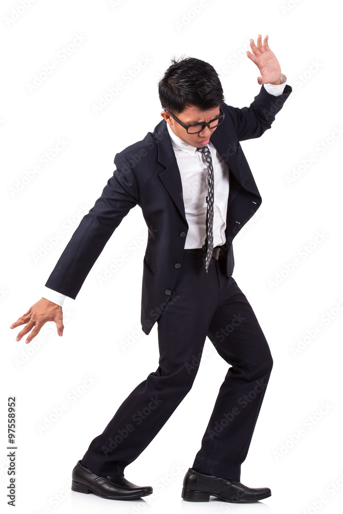 scared businessman walking on invisible. isolated on white background scared businessman walking on invisible. isolated on white background