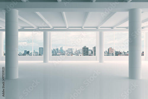 Modern white hangar area with city view