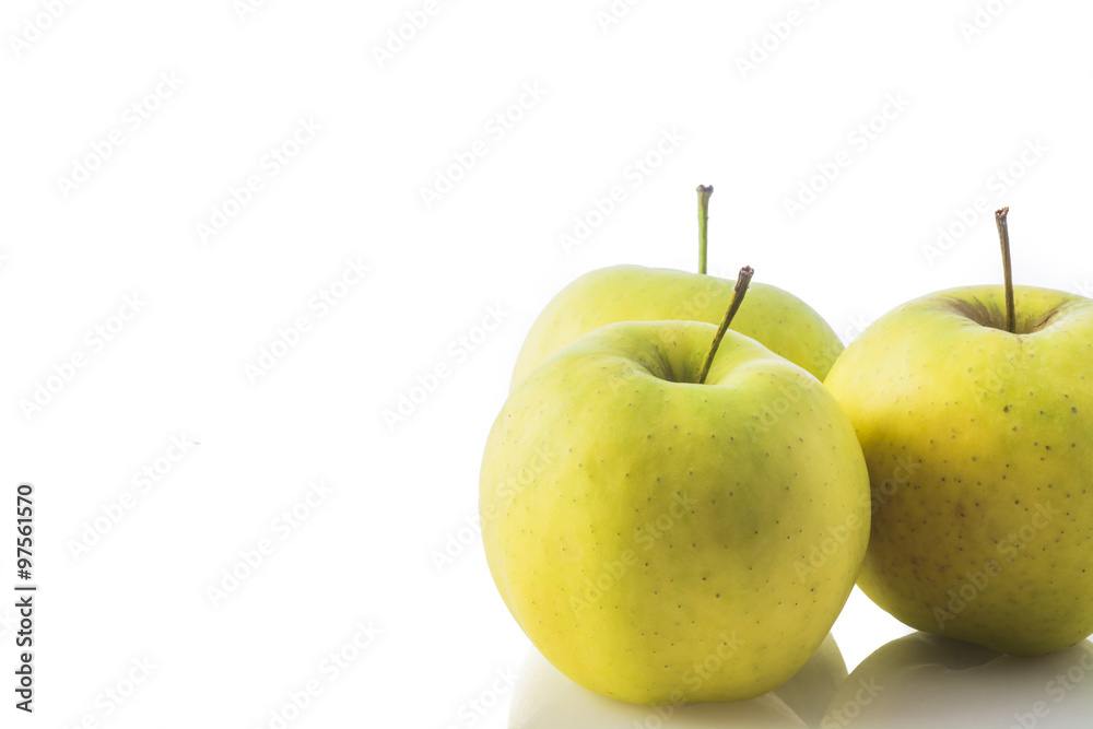 composition of three biological yellow apples on white background composition of three biological yellow apples on white background