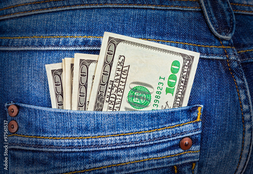 Fotografi Banknotes of one hundred american dollars in the back jeans pock