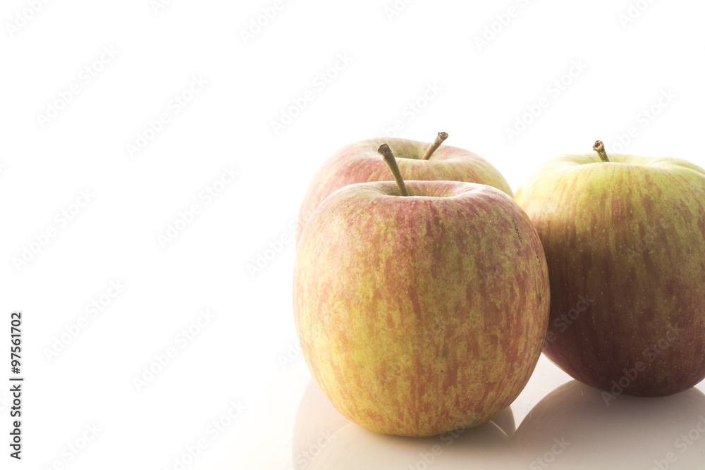 composition of three biological red apples on white background composition of three biological red apples on white background
