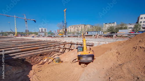 Yellow excavators at Construction of a new circular metro line. Russia, Moscow timelapse photo