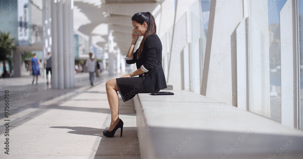Elegant businesswoman talking on her mobile Elegant businesswoman talking on her mobile