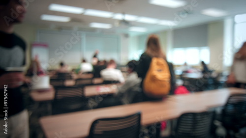 Back to School concept with Students Entering into a Blurred Classroom photo