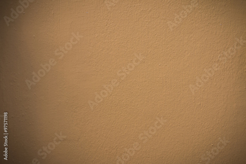 Closeup and blur of the old orange cement wall texture