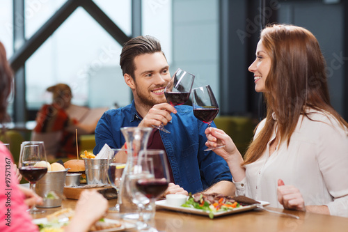 couple dining and drinking wine at restaurant