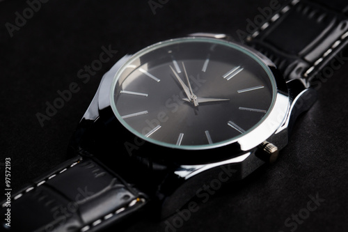 close up of black classic male wristwatch