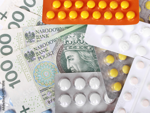 Zloty money bills and colorful pills