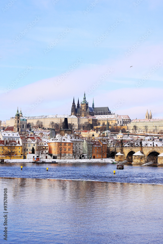 Christmas snowy Prague Lesser Town with gothic Castle and Charles Bridge, Czech Republic