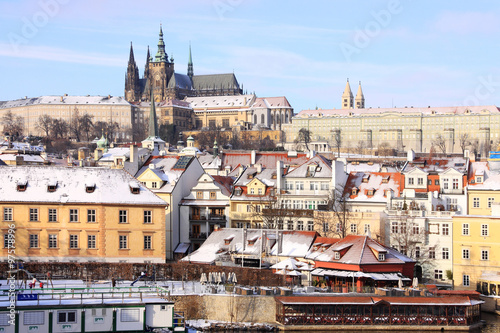 Christmas snowy Prague gothic Castle above River Vltava in the sunny Day, Czech Republic